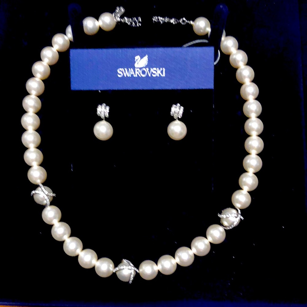 Brand new Swarovski necklace and earrings. Crystal Pearl beads with some bling.